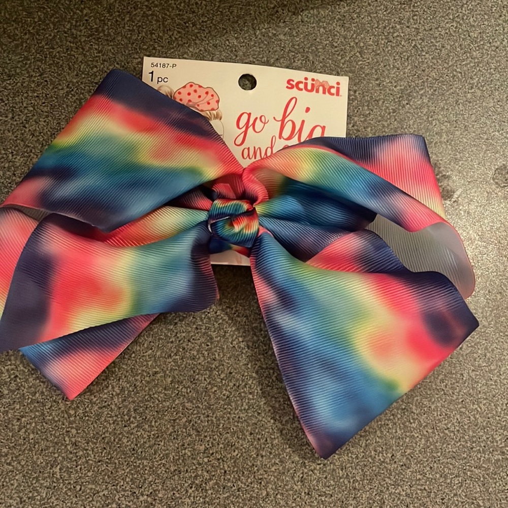 Scunci Go big and go bow rainbow bow. Brand new. Never warn. New